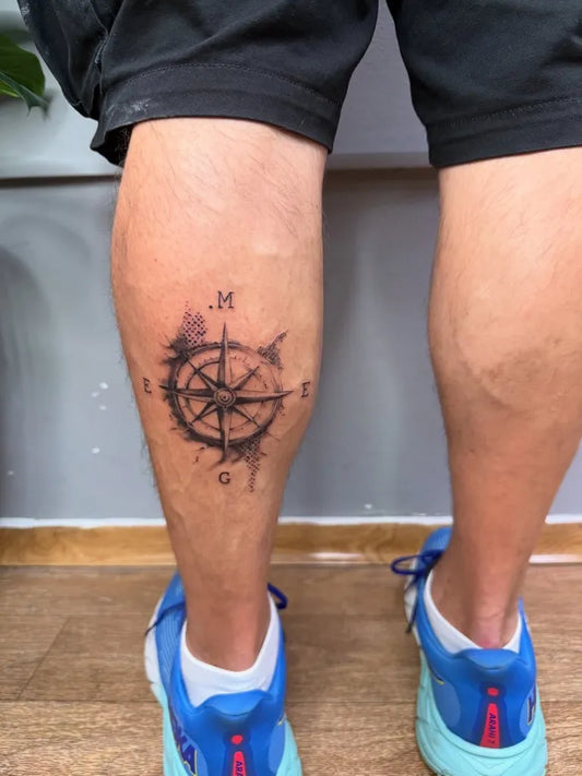 Medium Black and Grey Compass Rose on Men Leg Tattoo by @noy_ink_lady