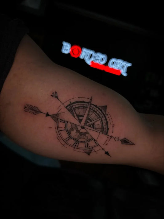 Medium Black and Grey Compass with Arrows on Men Arm Tattoo by @borneoarttattoogallery