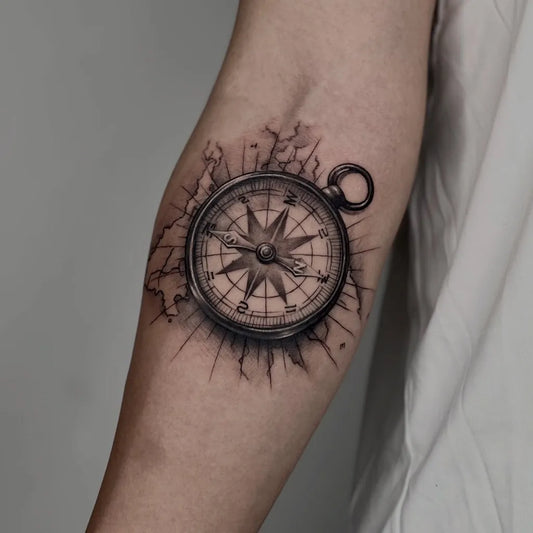 Medium Black and Grey Compass with Cracks on Men Arm Tattoo by @dreamhandstattoostudio