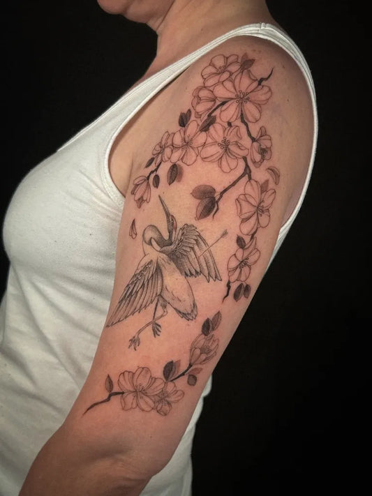 Medium Black and Grey Crane and Cherry Blossom on Women Arm Tattoo by @vives.ttt
