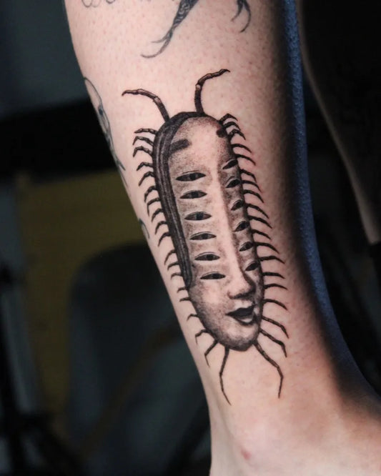 Medium Black and Grey Creepy Centipede Tattoo on Men Leg by @daiku_inks