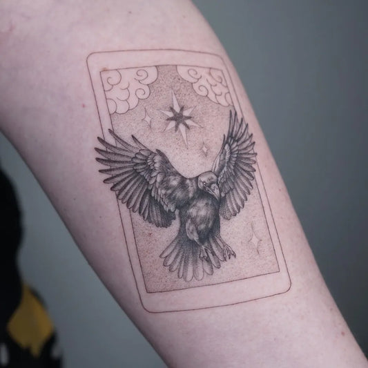 Medium Black and Grey Crow Tarot Card Tattoo on Women Arm by @daintylines_tattooing
