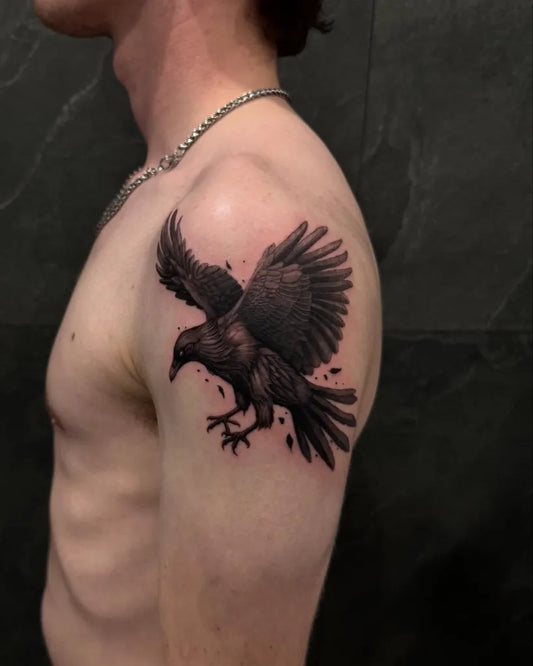 Medium Black and Grey Crow Tattoo on Men Shoulder by @kevwernertattoo