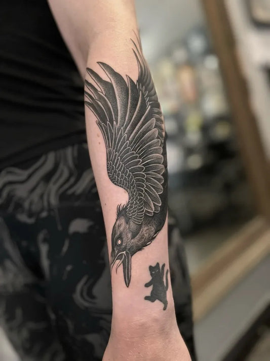 Medium Black and Grey Crow and Bear Tattoo on Men Arm by @blackhearttattooepsom