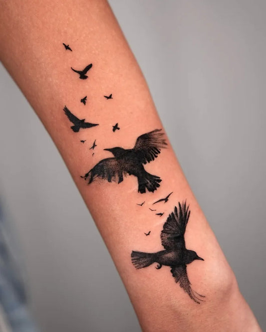 Medium Black and Grey Crow and Birds Tattoo on Women Arm by @tattooist_mate