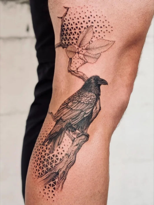 Medium Black and Grey Crow and Branch Tattoo on Men Leg by @tattoo.tante_kaethe