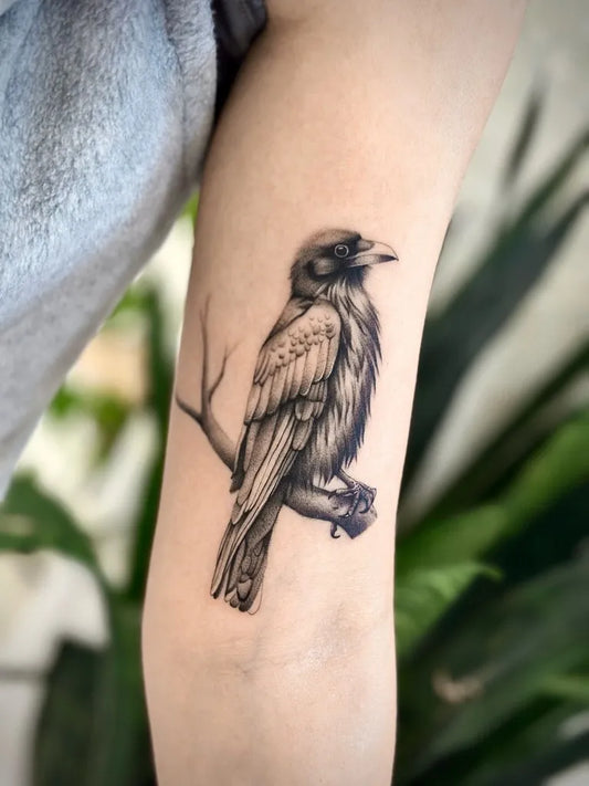 Medium Black and Grey Crow on Branch Tattoo on Women Arm by @baronarttattoo