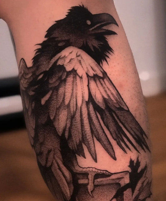 Medium Black and Grey Crow with Skull Tattoo on Men Arm by @zu_immortal