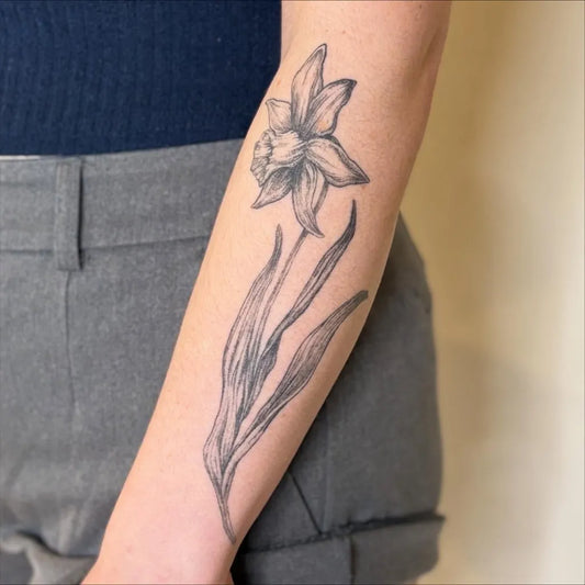 Medium Black and Grey Daffodil Tattoo on Women Arm by @solstattoos
