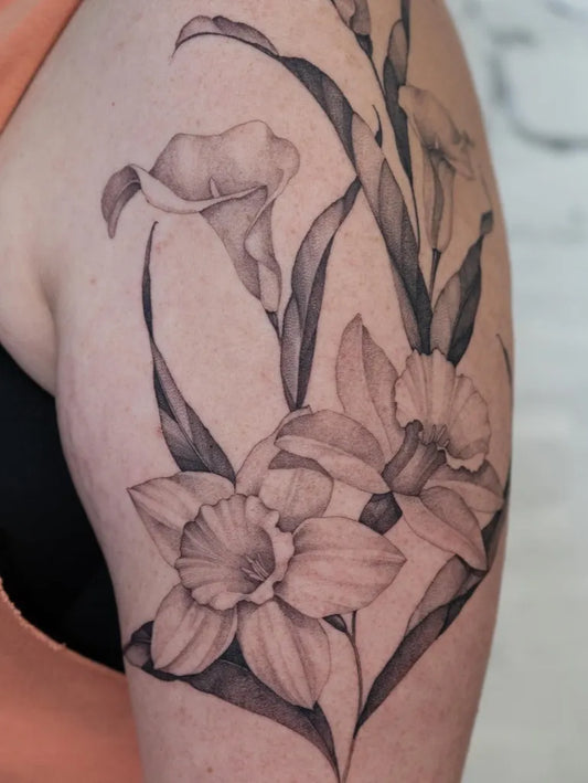 Medium Black and Grey Daffodil and Lily Tattoo on Women Shoulder by @lilyblu.ink