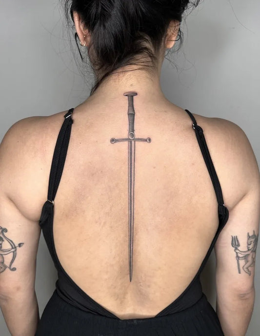 Medium Black and Grey Dagger Tattoo on Women Back by @dianaregalado
