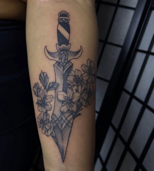 Medium Black and Grey Dagger and Cherry Blossom Tattoo on Women Arm by @inkedbyleah