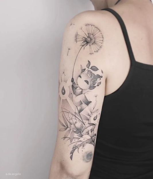 Medium Black and Grey Dandelion Fairy Flowers Tattoo on Women Shoulder by @anne.de.angelis
