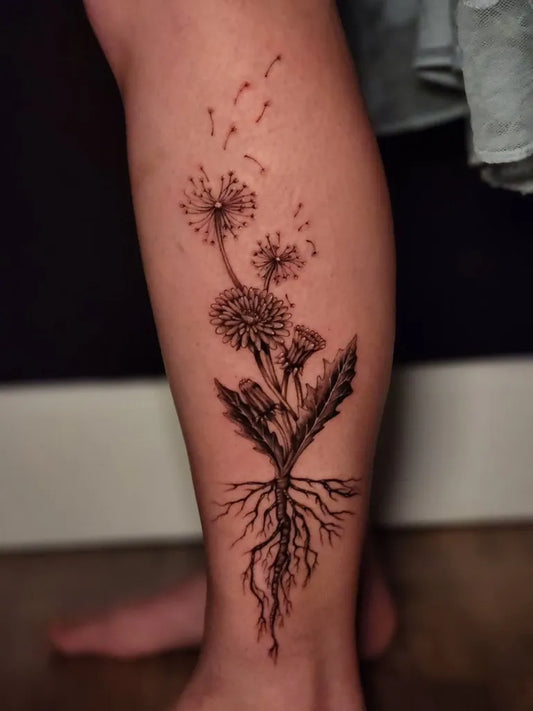 Medium Black and Grey Dandelion and Roots Tattoo on Women Leg by @crystaldawntattoos