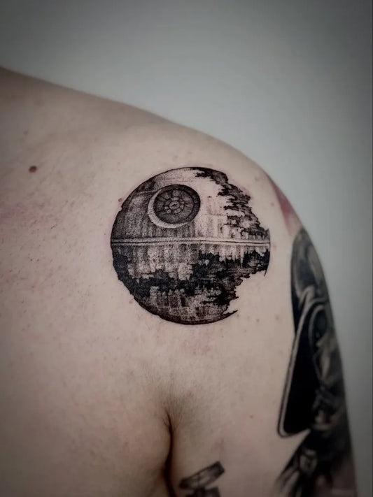 Medium Black and Grey Death Star Star Wars Tattoo on Men Shoulder by @mastilnicatattoo