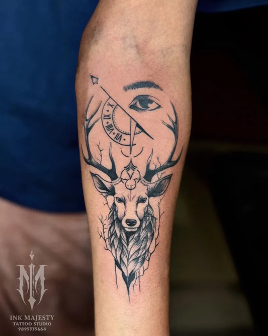 Medium Black and Grey Deer Eye Compass Tattoo on Men Arm by @tattoo_ink_majesty_taliparamba