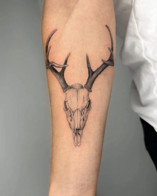 Medium Black and Grey Deer Skull Tattoo on Men Arm by @hazy_tattoos