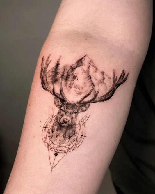 Medium Black and Grey Deer with Mountains and Mandala Tattoo on Women Arm by @vero_creato