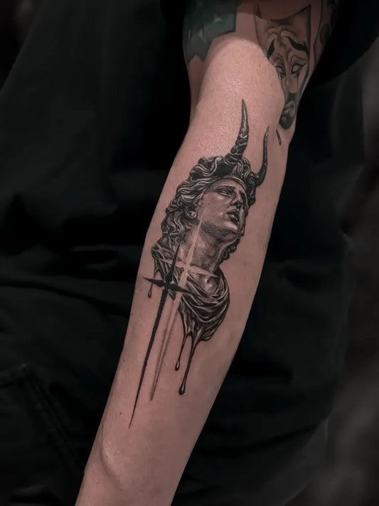 Medium Black and Grey Demon Head Tattoo on Men Arm by @ink.yanjen