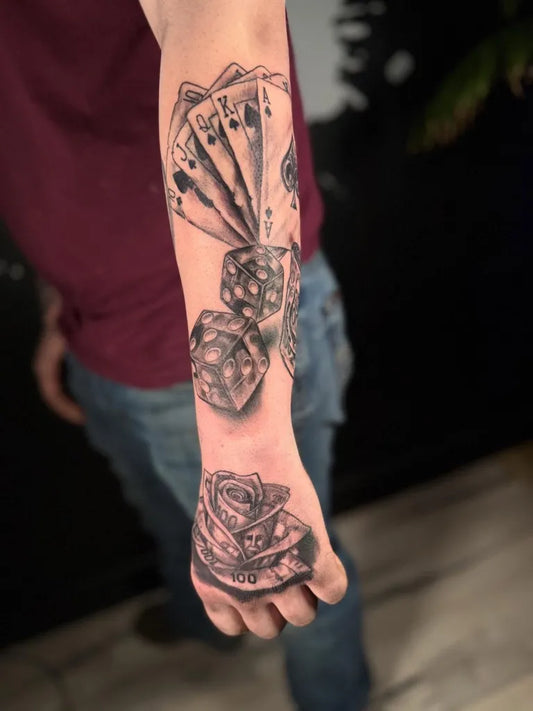 Medium Black and Grey Dice Cards Rose Tattoo on Men Arm by @metalroostertattoo