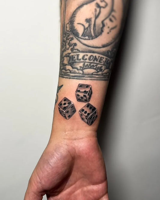 Medium Black and Grey Dice Tattoo on Men Wrist by @livebytheswordtattoo