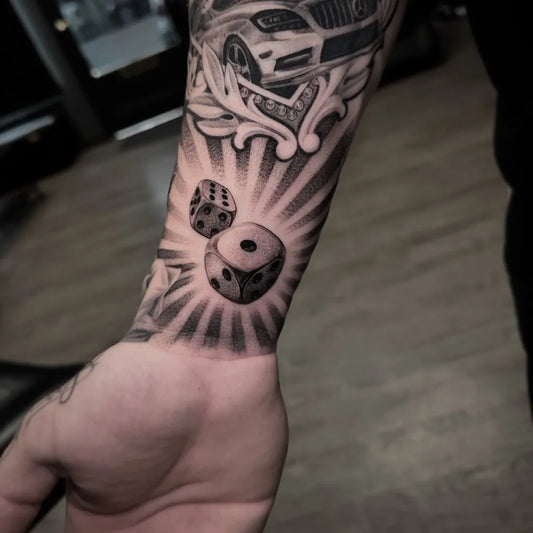 Medium Black and Grey Dice and Car Tattoo on Men Arm by @sm1_graffiti