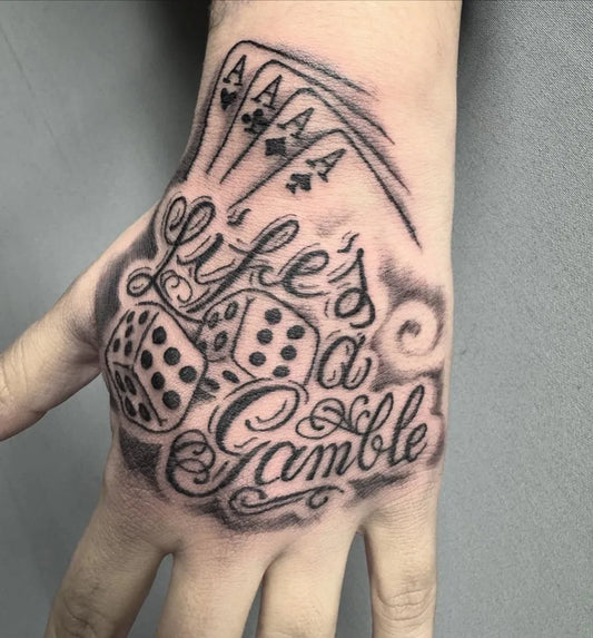 Medium Black and Grey Dice and Cards Tattoo on Men Hand by @romanordtattoo