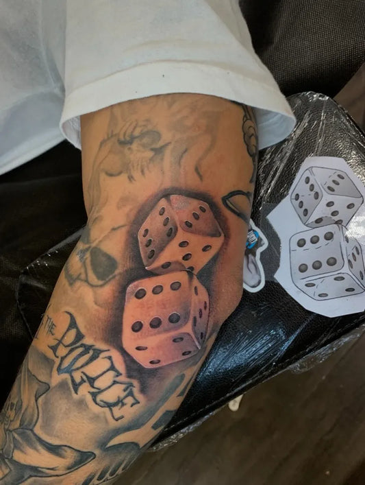 Medium Black and Grey Dice and Lettering Tattoo on Men Arm by @battsye_tattoos