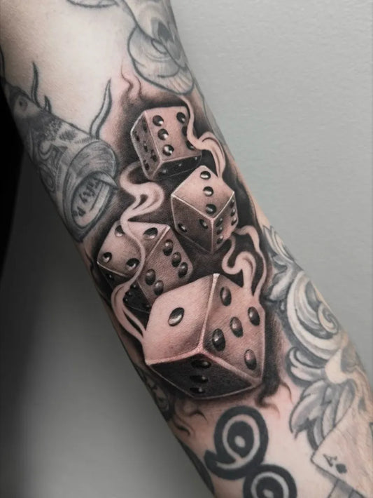 Medium Black and Grey Dice and Smoke Tattoo on Women Arm by @ccquid