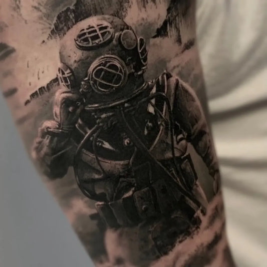 Medium Black and Grey Diver Helmet Tattoo on Men Arm by @kiyoharu_tattooer