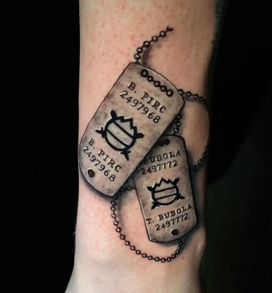 Medium Black and Grey Dog Tags Military Tattoo on Men Arm by @uriela_tattoostudio