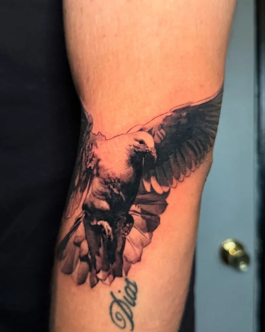 Medium Black and Grey Dove Tattoo on Men Arm by @reyr1tattoo