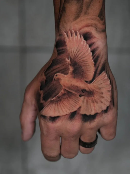 Medium Black and Grey Dove Tattoo on Men Hand by @valerioart