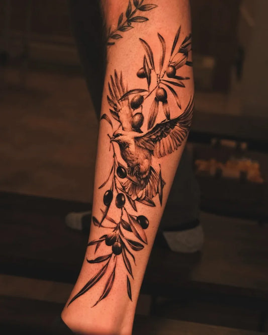 Medium Black and Grey Dove and Olive Branch Tattoo on Men Leg by @d.gone_ttt