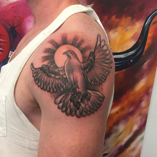 Medium Black and Grey Dove and Sun Tattoo on Men Shoulder by @danitheo__ifbbpro