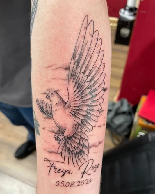 Medium Black and Grey Dove with Name and Date Tattoo on Men Arm by @tbt_is_love_tattoo
