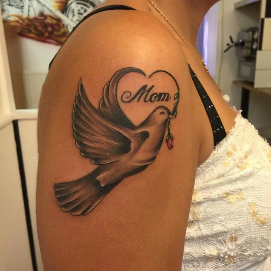 Medium Black and Grey Dove with Rose and Mom Text Tattoo on Women Shoulder by @malmo_ink_ta
