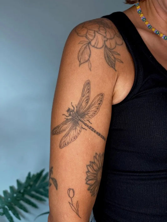 Medium Black and Grey Dragonfly Flowers on Women Shoulder Tattoo by @ulaluart