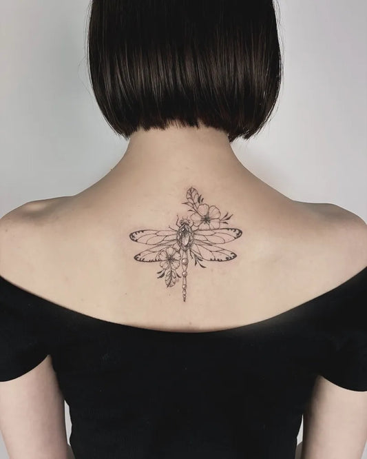 Medium Black and Grey Dragonfly and Flowers on Women Back Tattoo by @daria.inkwaves