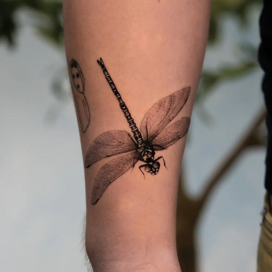 Medium Black and Grey Dragonfly and Ghost on Men Arm Tattoo by @danielle.tattoos