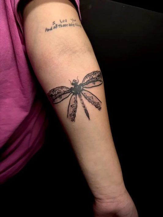 Medium Black and Grey Dragonfly on Women Arm Tattoo by @sacrificial_needle