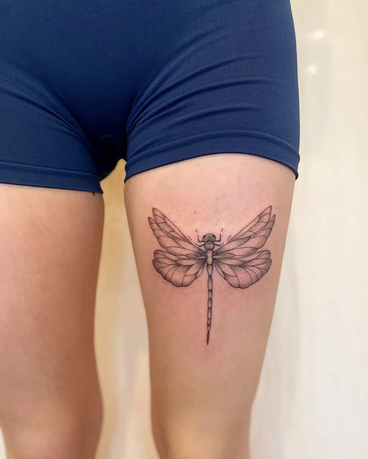 Medium Black and Grey Dragonfly on Women Thigh Tattoo by @em.j.ink
