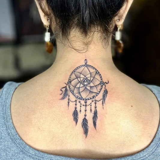Medium Black and Grey Dream Catcher Tattoo on Women Back by @the_glam_ink_studio