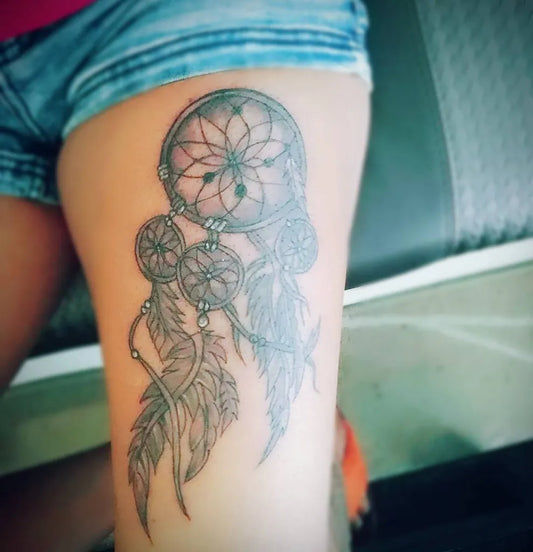 Medium Black and Grey Dream Catcher Tattoo on Women Thigh by @zero3_tattoo_nail_studio