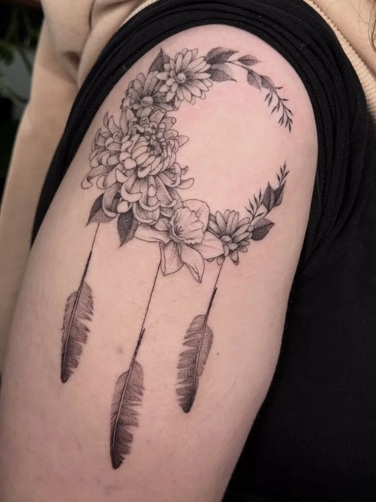 Medium Black and Grey Dream Catcher with Flowers and Feathers Tattoo on Women Shoulder by @thisis_doro