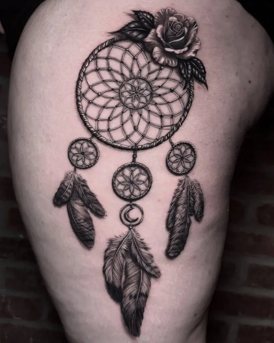 Medium Black and Grey Dream Catcher with Rose and Crescent Moon Tattoo on Women Thigh by @reaper.rosen