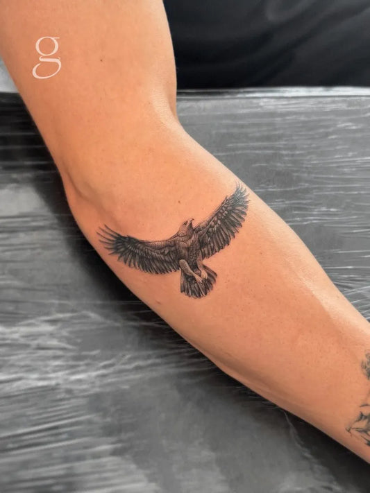 Medium Black and Grey Eagle Tattoo on Men Arm by @irenegarre.tattoo