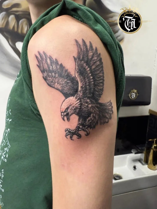 Medium Black and Grey Eagle Tattoo on Men Arm by @tattooasylumstudio