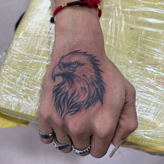 Medium Black and Grey Eagle Tattoo on Men Hand by @ektatattooart
