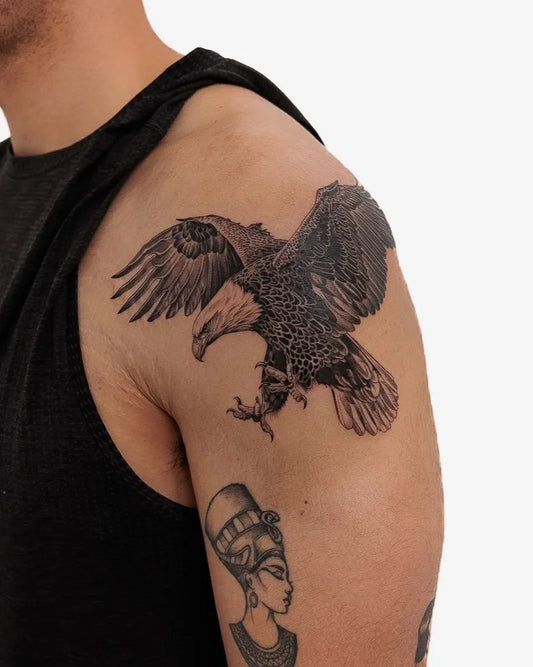 Medium Black and Grey Eagle and Nefertiti Tattoo on Men Shoulder by @lozzarachtattooer